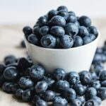 blueberries on white ceramic container